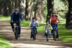 Family on bikes enjoying the gardens at Clumber Park, Nottinghamshire